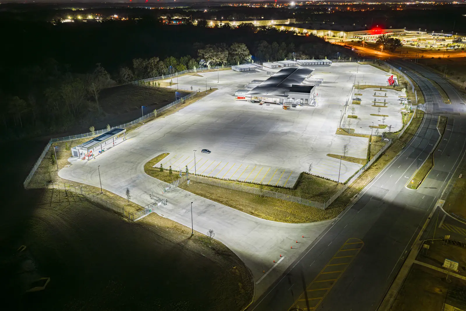 Night drone photography of the Averitt trucking service center in Ocala FL with full exterior lighting active