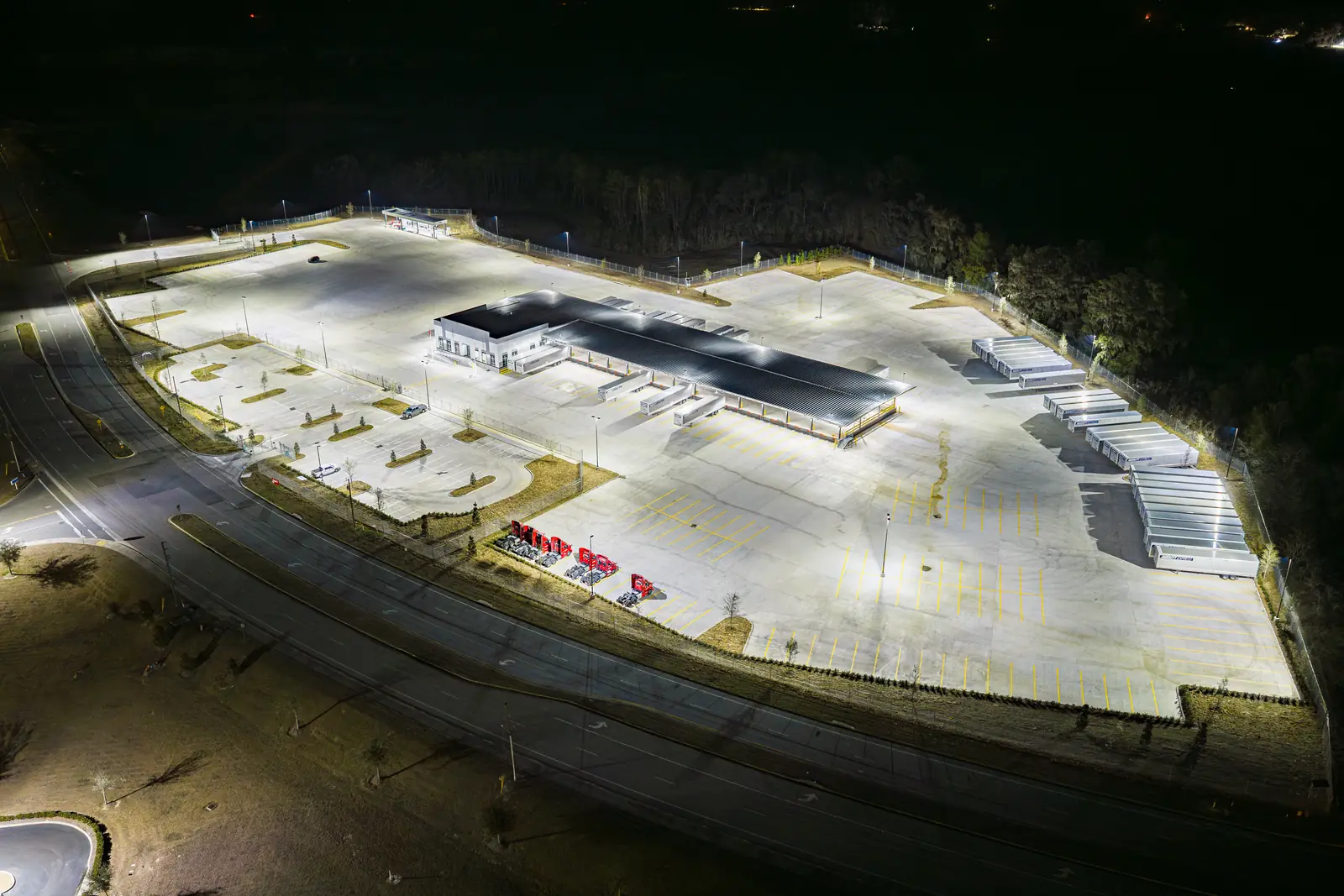 Drone night shot of dock doors and trailer parking at the new Averitt freight terminal near I-75, Marion County