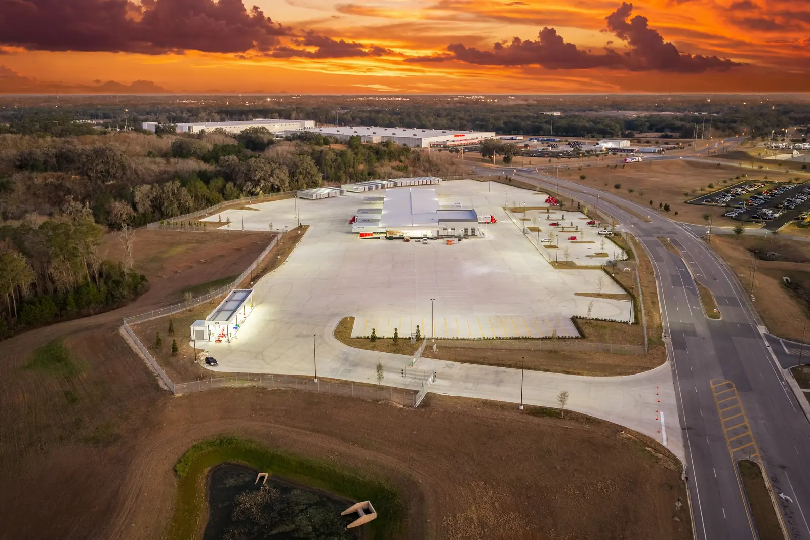 Dusk aerial photography of the Averitt cross-dock facility near I-75, Ocala Florida — trailer parking and building exterior