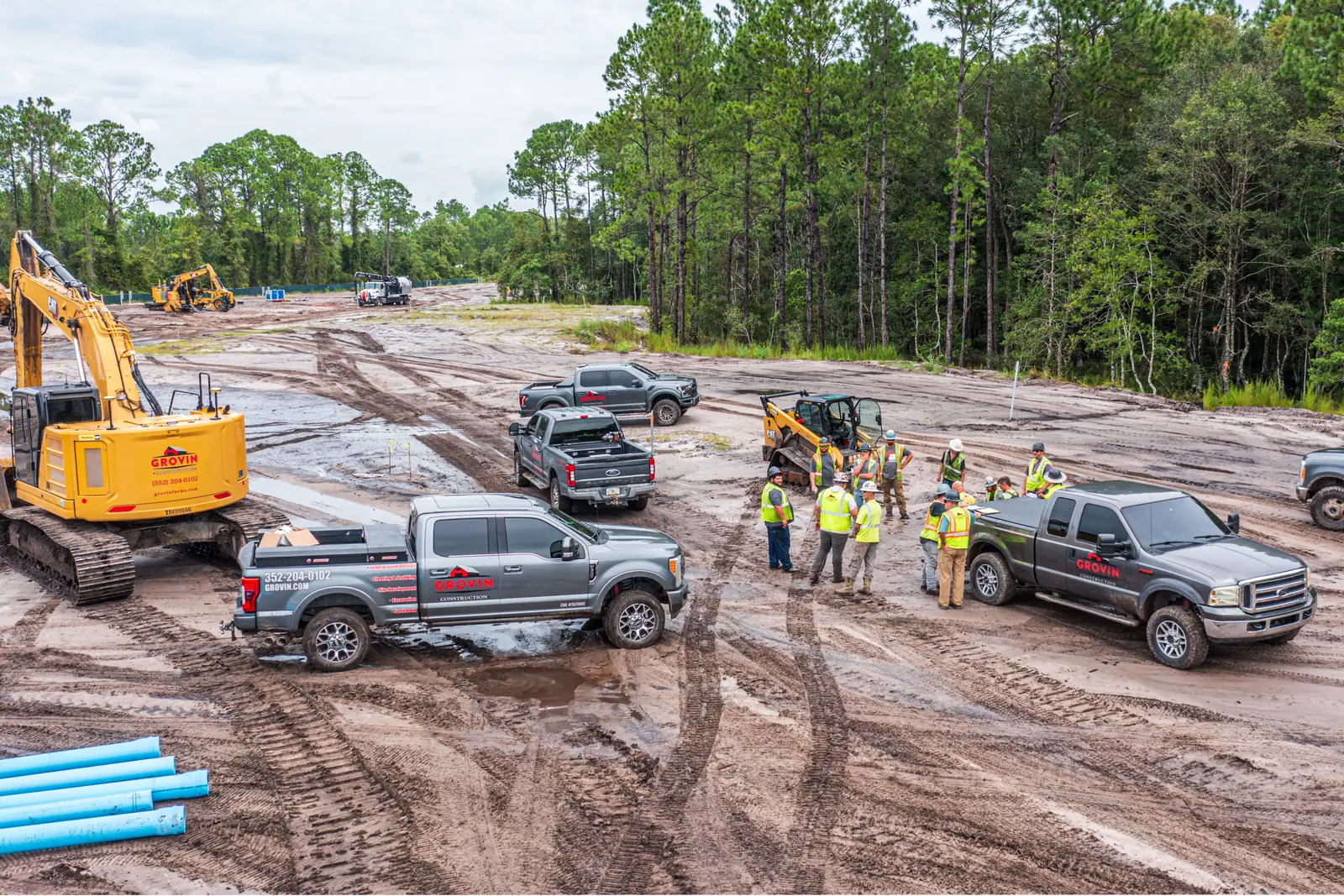 Recurring drone site visit capturing sitework crews, equipment and pipe staging at the Coquina Crossing land development near St. Augustine FL