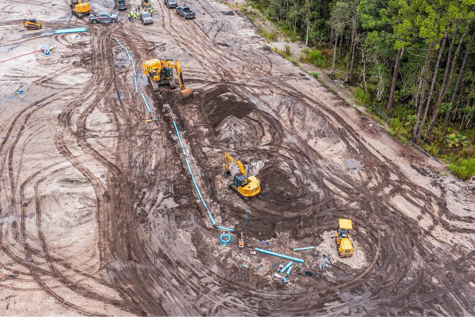 Drone photo of storm drainage and utility trench excavation during residential land development site work in Northeast Florida