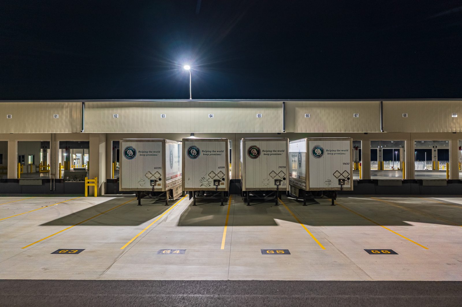 Night aerial photography Old Dominion Freight Line Wildwood FL — dock yard illumination and facility lighting