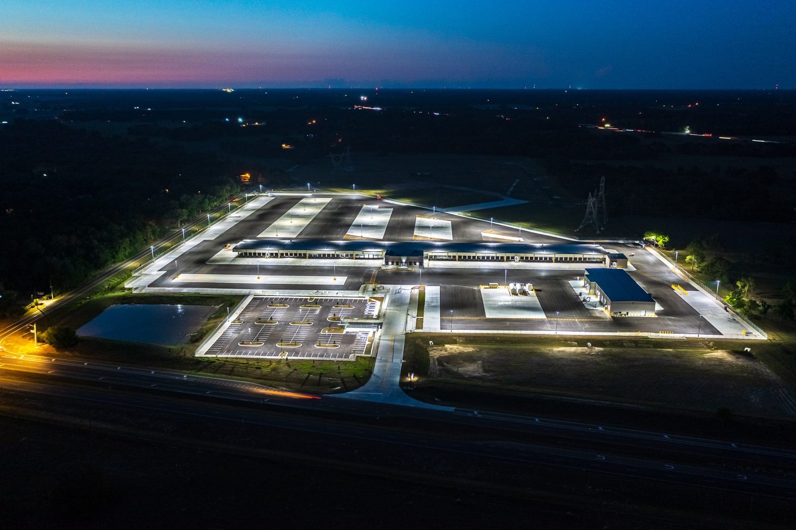 Drone night photography Old Dominion Wildwood warehouse — Sumter County FL commercial construction documentation