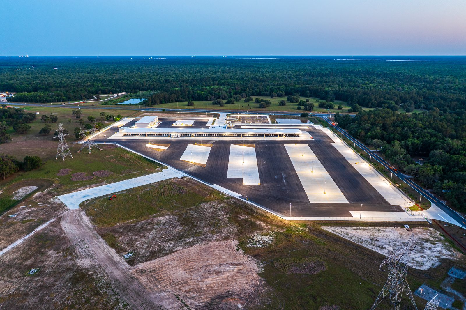 Dusk aerial photography Old Dominion LTL terminal Wildwood Florida — construction drone documentation