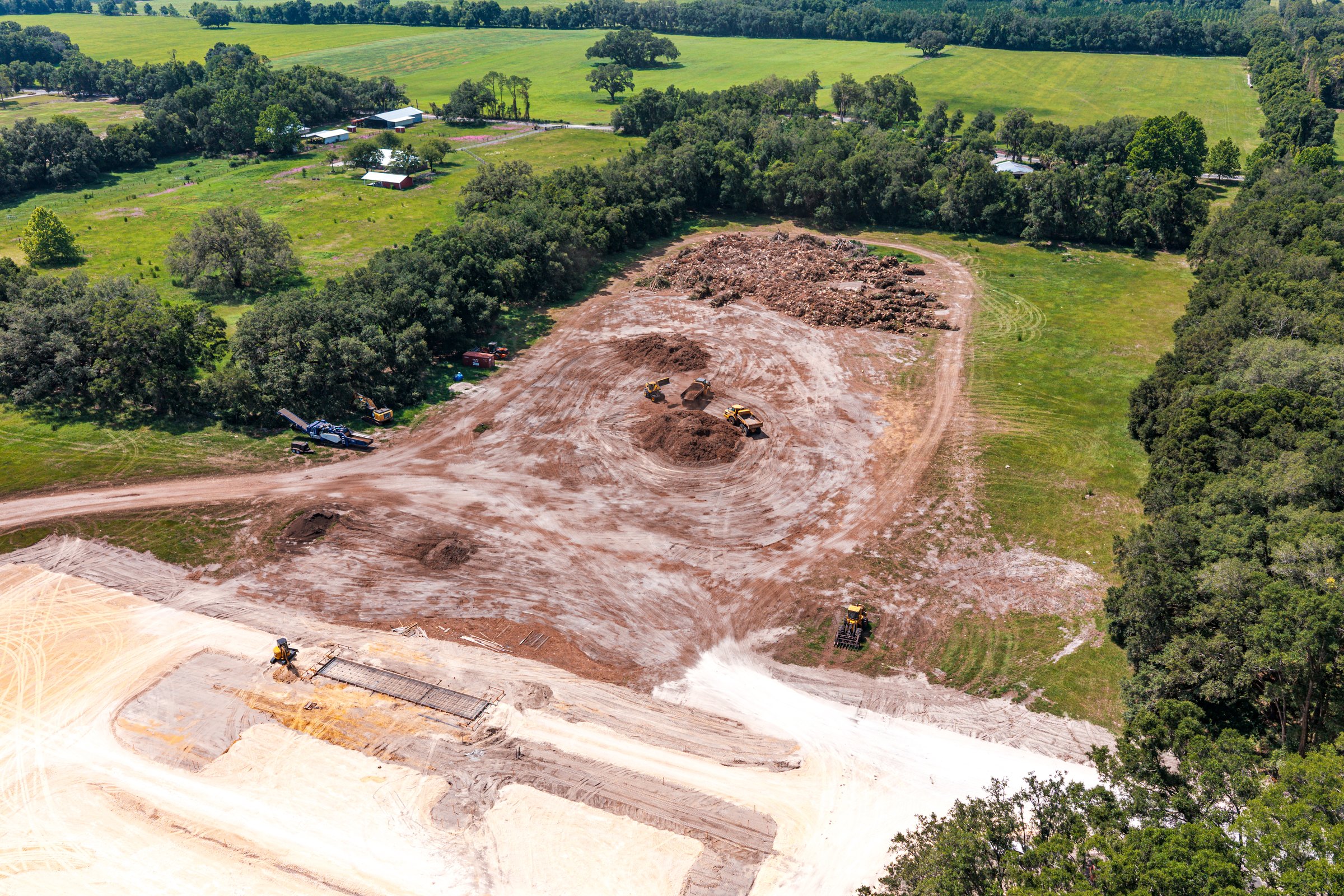 Site clearing in progress — equipment positions documented