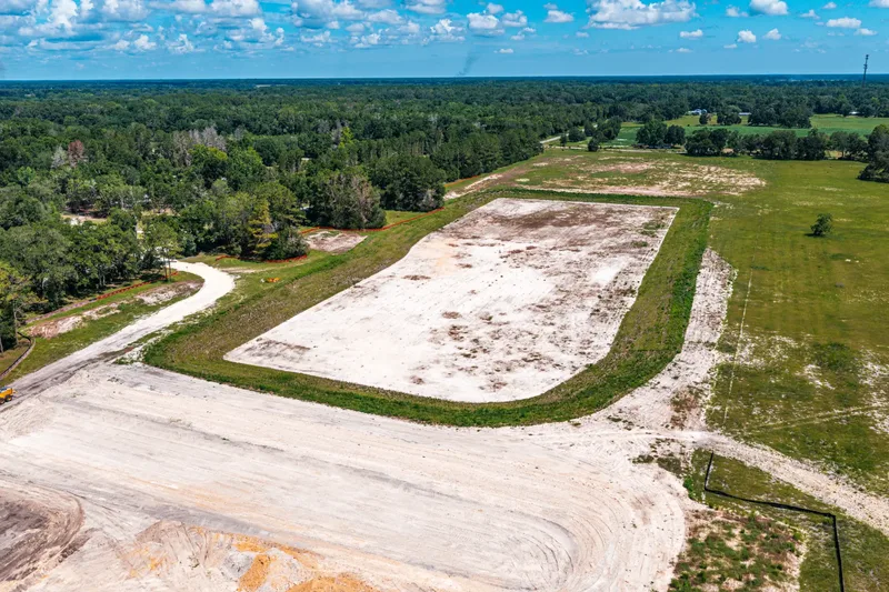 Aerial drone photo of the Newberry WWTP expansion site — pre-construction site conditions overview, Newberry, FL