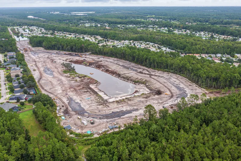 Aerial drone photo of a construction site in St. Augustine, FL — site overview and building progress