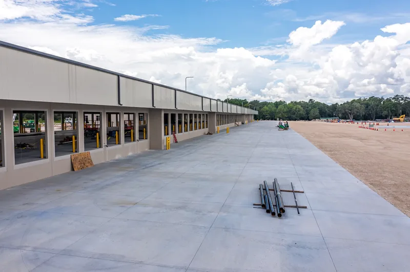 Aerial drone photo of the Old Dominion Freight Line Wildwood terminal — steel erection and structural framing, visit 21, July 2024