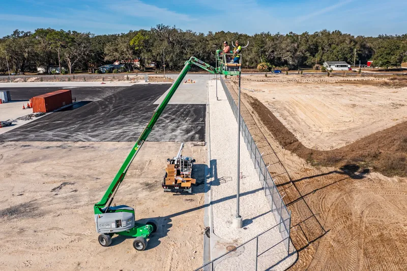 Aerial drone photo of the Old Dominion Wildwood terminal construction site — building envelope and paving progress, visit 33, January 2025
